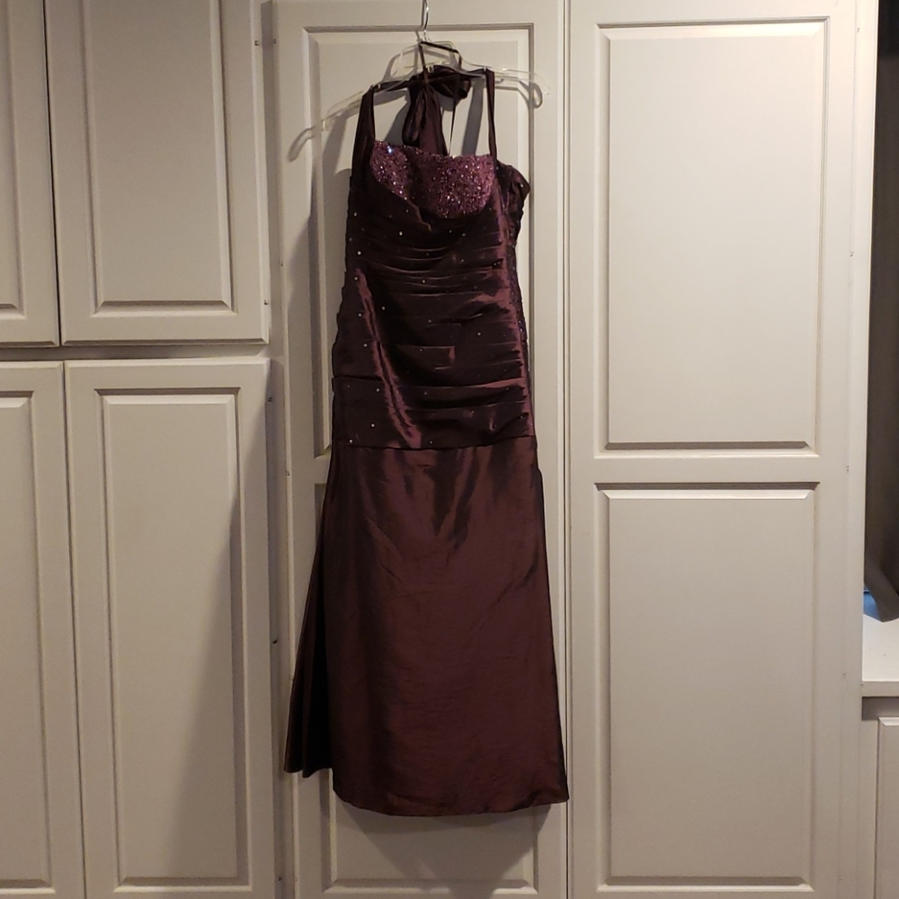 Plum floor length gathered halter dress.